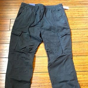 Black Gap Flex men’s utility jogger. Drawstring waistband, slim through thigh.